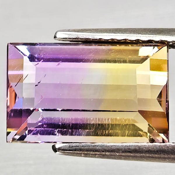 Natural Bi Color Ametrine 3.76 Ct. Octagon Shape 11.1 x 7.1 Mm Gemstone From Bolivia: Product ID: 800408237 Product Name: Natural Ametrine Weight: 3.76 CT. Size: 11.1 x 7.1 x 5.9 MM. Shape: Octagon Color: Bi Color Clarity:VSI - SI1 Luster: Good Gems Origin: Bolivia Treatment: Unheated 