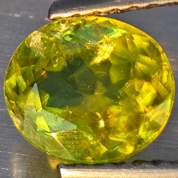 Natural Multi Color Sphene With Rainbow Spark 1.20 Ct. Oval Shape 7.5 x 6.8 Mm Gemstone From: Product ID: 806509135 Product Name: Natural Sphene Weight: 1.20 CT. Size: 7.5 x 6.8 x 3.4 MM. Shape: Oval Color: Multi Color With Rainbow Spark Clarity:SI1 Luster: Good Gems Origin: Madagascar Treatme