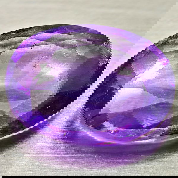 Natural Purple Amethyst 8.63 Ct. Oval Shape 16.3 x 12.9 Mm Gemstone from Brazil: Product ID: 800325453 Product Name: Natural Amethyst Weight: 8.63 CT. Size: 16.3 x 12.9 x 5.7 MM. Shape: Oval Color: Purple Clarity:VSI Luster: Good Gems Origin: Brazil Treatment: Unheated Crystal Str