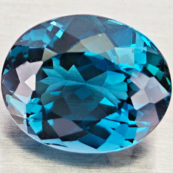 Natural London Blue Topaz 5.71 Ct. Oval Shape 11.5 x 9.4 Mm Gemstone From Brazil: Product ID: 807168433 Product Name: Natural Blue Topaz Weight: 5.71 CT. Size: 11.5 x 9.4 x 6.9 MM. Shape: Oval Color: London Blue Clarity:VVS - VSI Luster: Very Good Gems Origin: Brazil Treatment: Tre