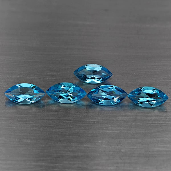 Natural Swiss Blue Topaz 6.29 Ct. 5 Pcs Marquise Shape 10 x 5.1 Mm Gemstone From Brazil: Product ID: 807168704 Product Name: Natural Blue Topaz Weight: 6.29 CT. Size: 10 x 5.1 x 3.6 MM. Shape: Marquise Shape Color: Swiss Blue Clarity:VSI Luster: Good Gems Origin: Brazil Treatment: Treated