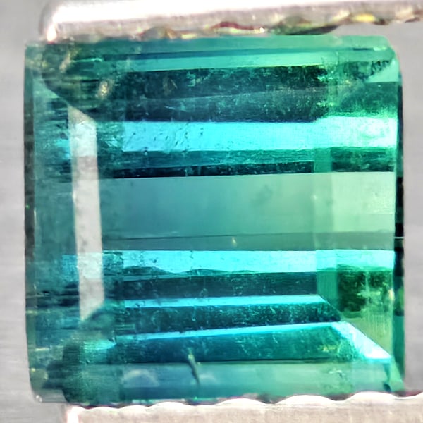 Natural Green Tourmaline 0.82 Ct. Baguette Shape 5 x 4.6 Mm Gemstone from Nigeria: Product ID: 807251195 Product Name: Natural Tourmaline Weight: 0.82 CT. Size: 5 x 4.6 x 3.7 MM. Shape: Baguette Color: Green Clarity:SI1 Luster: Good Gems Origin: Nigeria Treatment: Unheated Crystal S