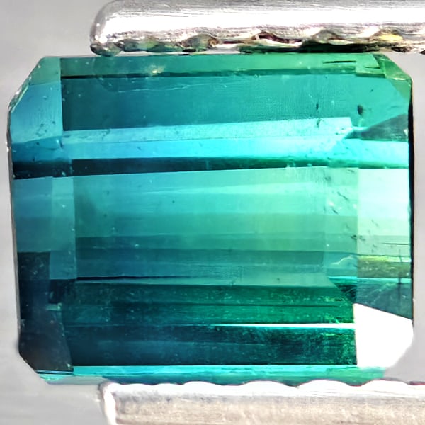 Natural Bluish Green Tourmaline 1.23 Ct. Octagon Shape 5.7 x 4.7 Mm Gemstone from Nigeria: Product ID: 807251190 Product Name: Natural Tourmaline Weight: 1.23 CT. Size: 5.7 x 4.7 x 4.4 MM. Shape: Octagon Shape Color: Bluish Green Clarity:SI1 Luster: Good Gems Origin: Nigeria Treatment: Unhe