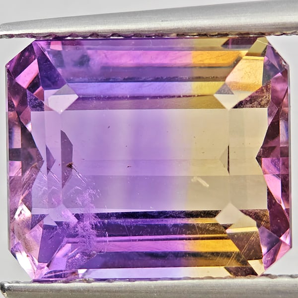 Natural Bi Color Ametrine 5.42 Ct. Octagon Shape 11.3 x 9.6 Mm Gemstone From Bolivia: Product ID: 800408622 Product Name: Natural Ametrine Weight: 5.42 CT. Size: 11.3 x 9.6 x 6.5 MM. Shape: Octagon Color: Bi Color Clarity:VSI Luster: Good Gems Origin: Bolivia Treatment: Unheated Crysta