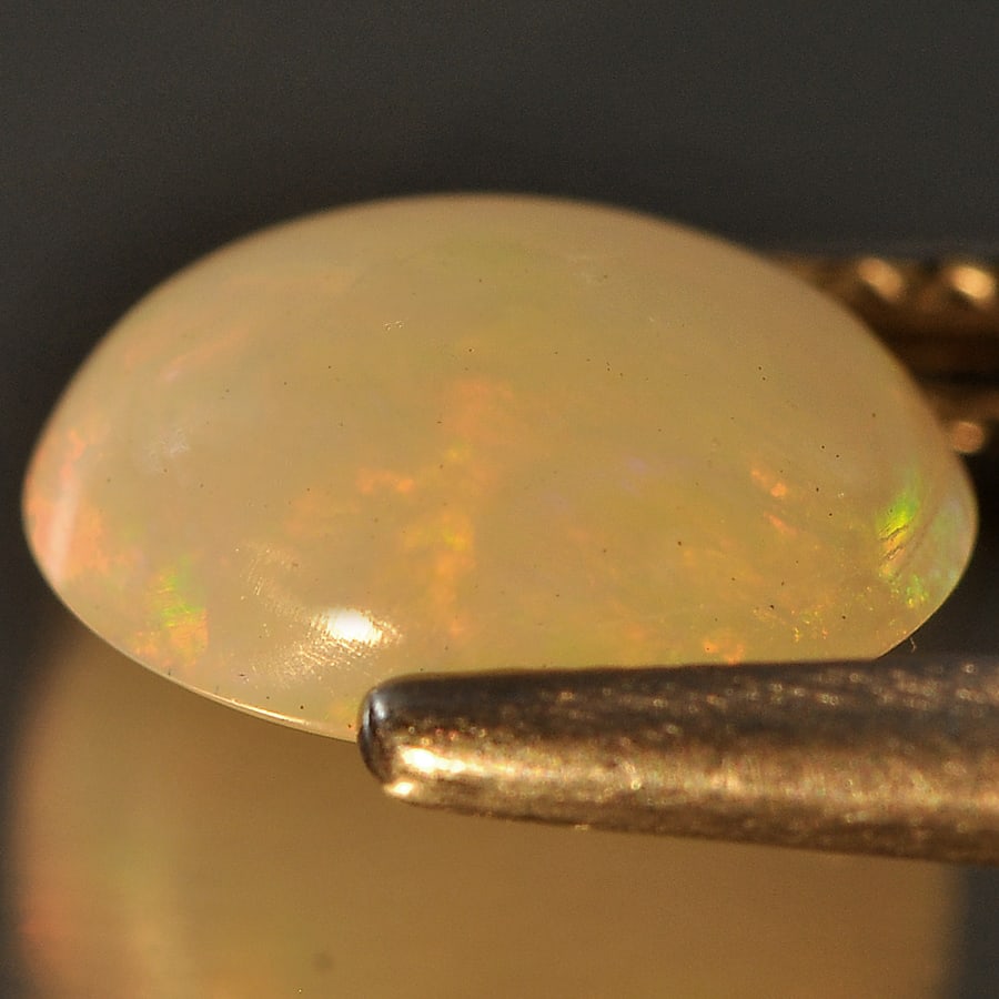 Natural Multi Color Opal 1.08 Ct. Oval Cabochon Shape 8.7 x 7 Mm Gemstone from Ethiopia: Product ID: 818709099 Product Name: Natural Opal Weight: 1.08 CT. Size: 8.7 x 7 x 3.7 MM. Shape: Oval Cabochon Color: Multi Color Clarity:Semi - Transparent Luster: Good Gems Origin: Ethiopia Treatmen