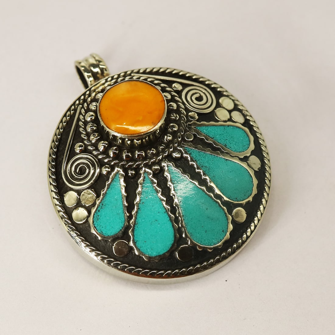 Turquoise & Copal Handmade Tibetan Silver Pendant: Product ID: 250804180545Product - Tibetan Handmade PendantSize - 4.2X4.2 CM RoundWeight - 39 GramMetal - Brass & Copper mix MetalOrigin - NepalCountry/Region of Manufacture - Nepal At Your Service: At