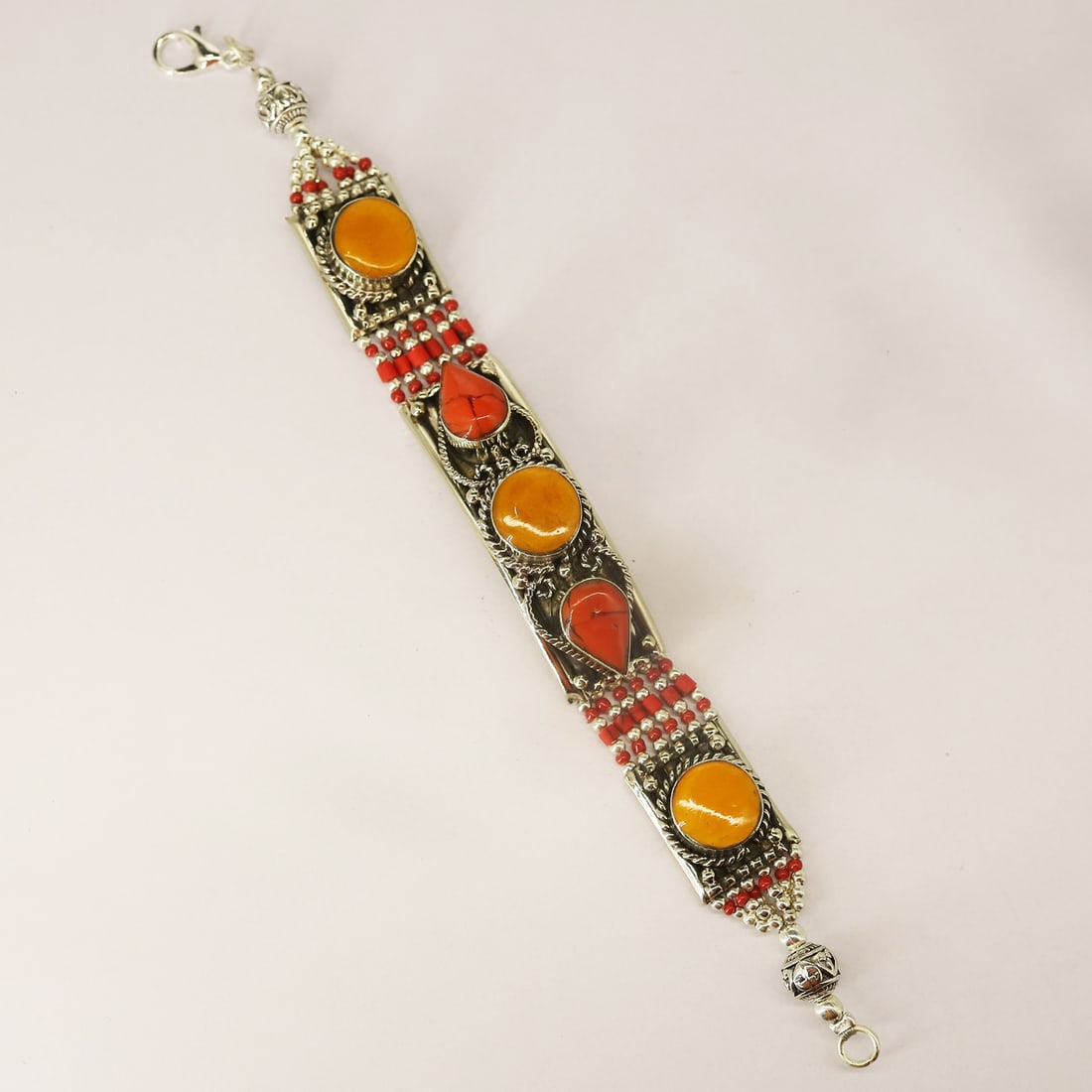 Tibetan Red Coral & Copal Handmade Boho Bracelet: Product ID: 250812134533 Product - Tibetan Handmade Bracelet Gemstone - Natural Coral & Copal Size - 7 Inch Weight - 60 gram Metal - Brass & Copper mix Metal Origin - Nepal Country/Region of Manufactu