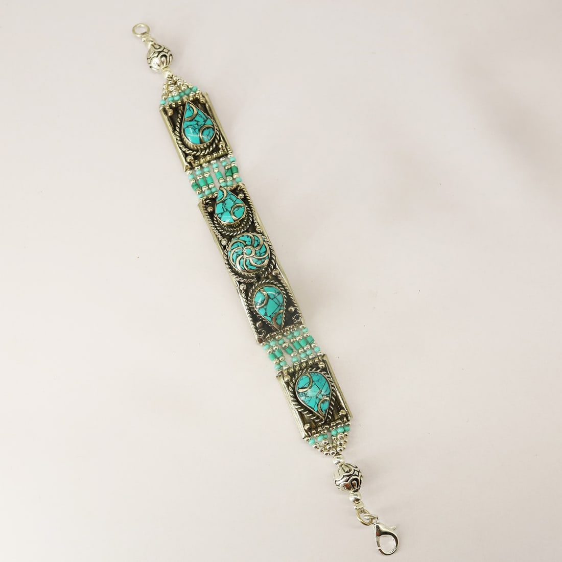 Tibetan Natural Turquoise Handmade Ethnic Bracelet: Product ID: 250812135546 Product - Tibetan Handmade Bracelet Gemstone - Natural Turquoise Size - 7 Inch Weight - 61 gram Metal - Brass & Copper mix Metal Origin - Nepal Country/Region of Manufacture -