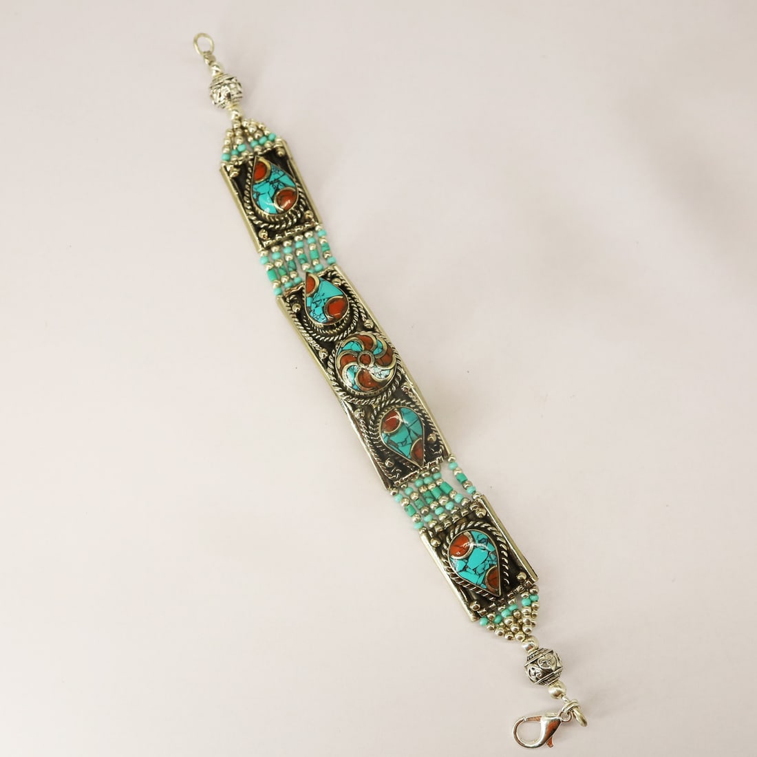 Tibetan Turquoise & Coral Handmade Unisex Bracelet: Product ID: 250811170914 Product - Tibetan Handmade Bracelet Gemstone - Natural Turquoise & Coral Size - 7 Inch Weight -60 gram Metal - Brass & Copper mix Metal Origin - Nepal Country/Region of Manufa