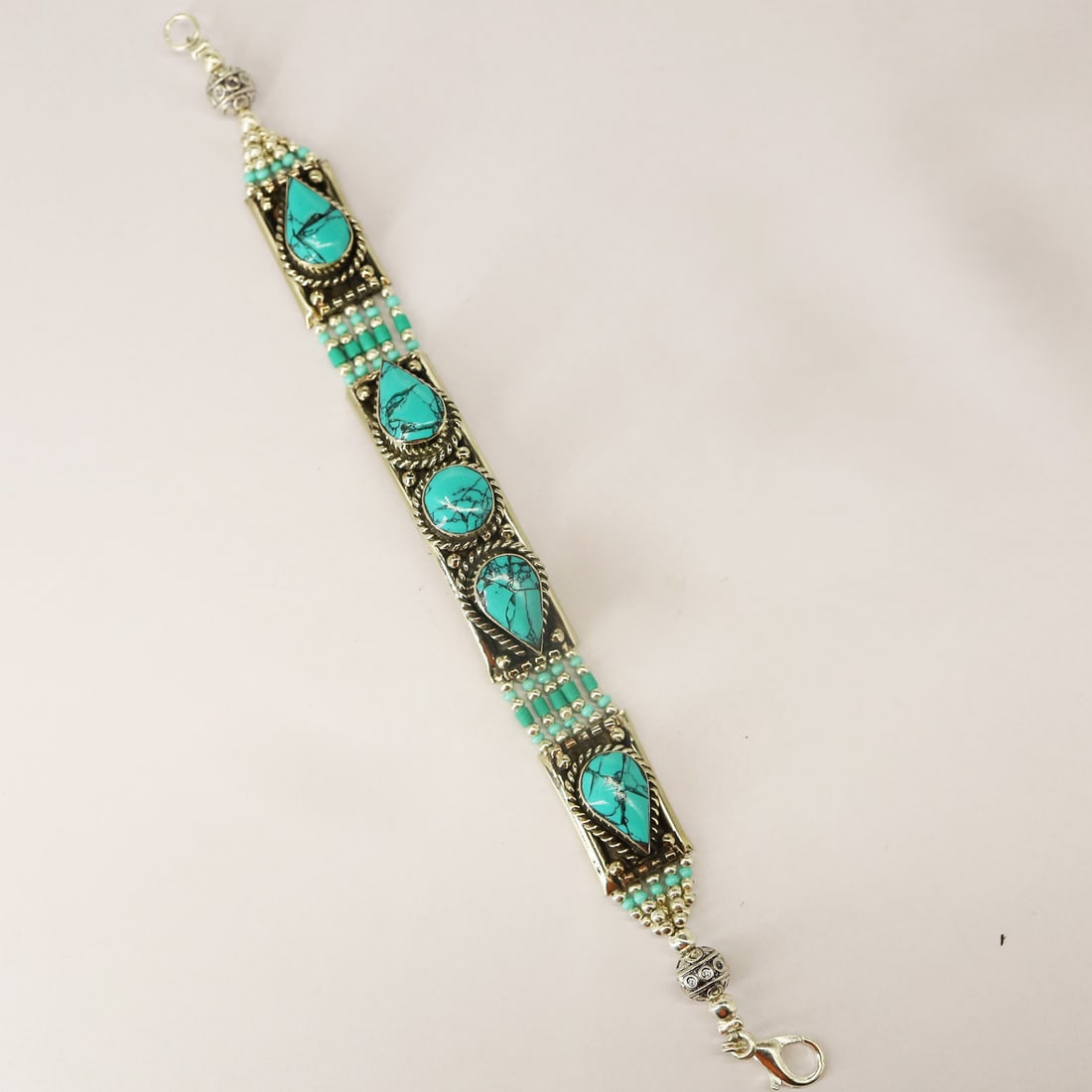 Tibetan Turquoise Handmade Boho Royal Bracelet: Product ID: 250812140757 Product - Tibetan Handmade Bracelet Gemstone - Natural Turquoise Size - 7 Inch Weight - 49 gram Metal - Brass & Copper mix Metal Origin - Nepal Country/Region of Manufacture -