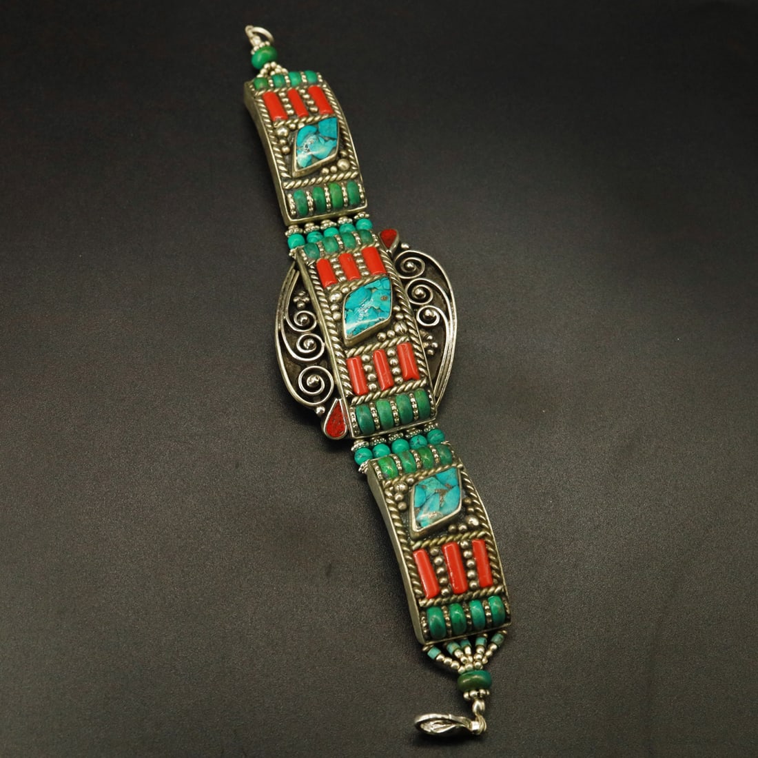 Tibetan Turquoise & Coral Handmade Ethnic Royal Bracelet: Product ID: 251003154736 Product - Tibetan Handmade Bracelet Gemstone - Natural Turquoise & Coral Size - 7 Inch Weight - 60 Gram Approx Metal - Brass & Copper mix Metal Origin - Nepal Country/Region o