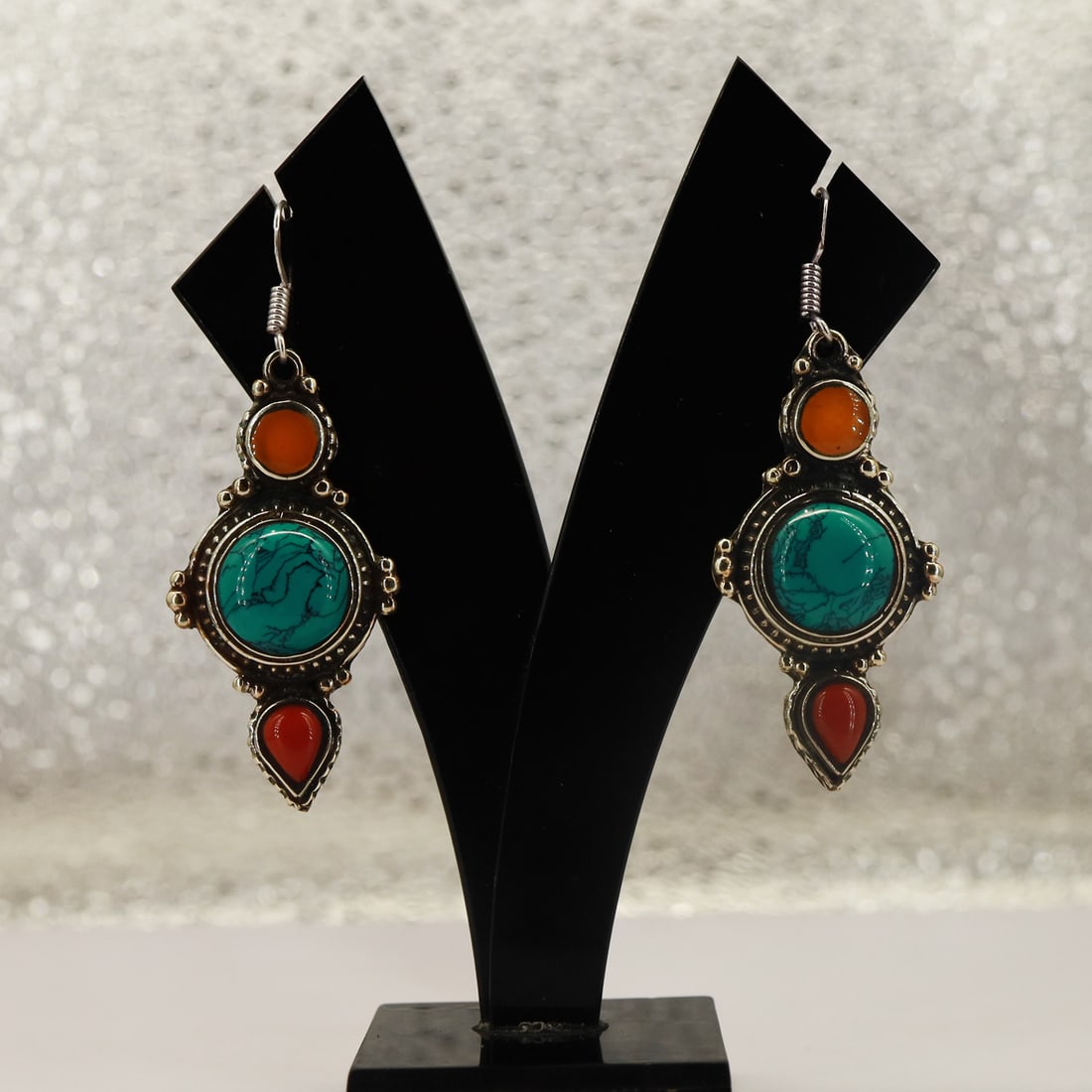 Tibetan Turquoise & Coral Handmade Designer Boho Earring: Product ID: 250821152721 Product - Tibetan Handmade Earring Gemstone - Natural Turquoise, Coral & Copal Size - 4.5 Cm Weight - 16 Gram Metal - Brass & Copper mix Metal Origin - Nepal Country/Region of
