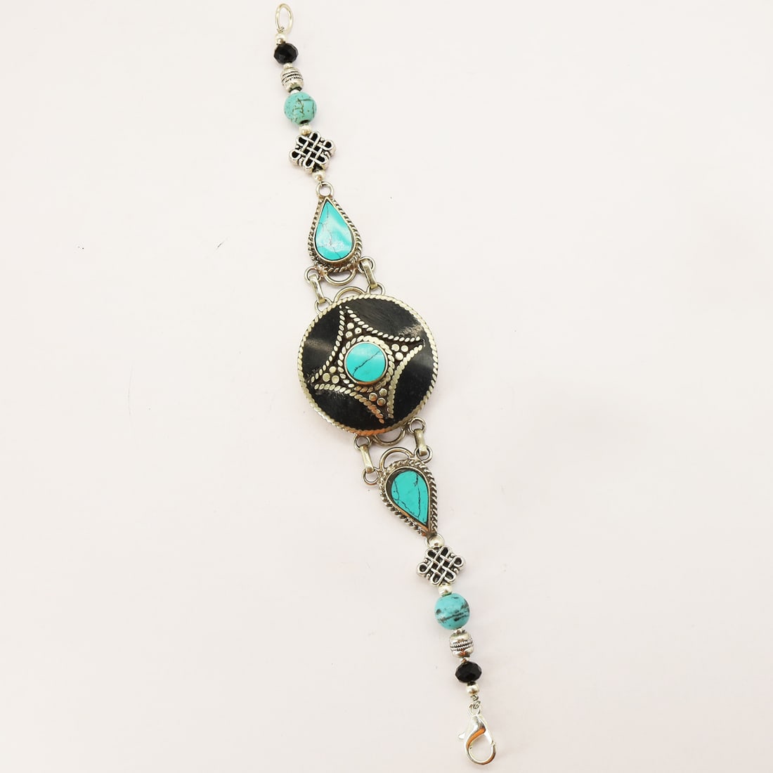 Tibetan Turquoise & Black Onyx Handmade Designer Bracelet: Product ID: 250810173421 Product - Tibetan Handmade Bracelet Gemstone - Natural Turquoise & Black Onyx Size - 7 Inch Weight - Metal - Brass & Copper mix Metal Origin - Nepal Country/Region of Manufact