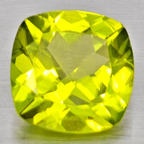Natural Green Peridot 1.39 Ct. Cushion Shape 7.1 x 7.1 Mm Gemstone From Pakistan: Product ID: 805317229 Product Name: Natural Peridot Weight: 1.39 CT. Size: 7.1 x 7.1 x 4 MM. Shape: Cushion Shape Color: Green Clarity:VSI - SI1 Luster: Good Gems Origin: Pakistan Treatment: Unheated