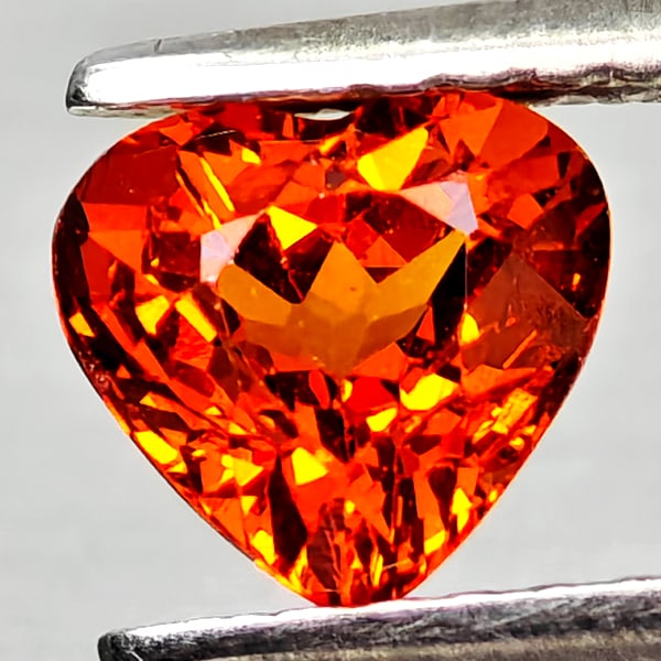 Natural Orangish Red Spessartine Garnet 0.98 Ct. Heart Shape 5.9 x 5.6 Mm Gemstone From Namibia: Product ID: 802936817 Product Name: Natural Spessartine Weight: 0.98 CT. Size: 5.9 x 5.6 x 3.8 MM. Shape: Heart Shape Color: Orangish Red Clarity:VSI Luster: Good Gems Origin: Namibia,Africa Treatment