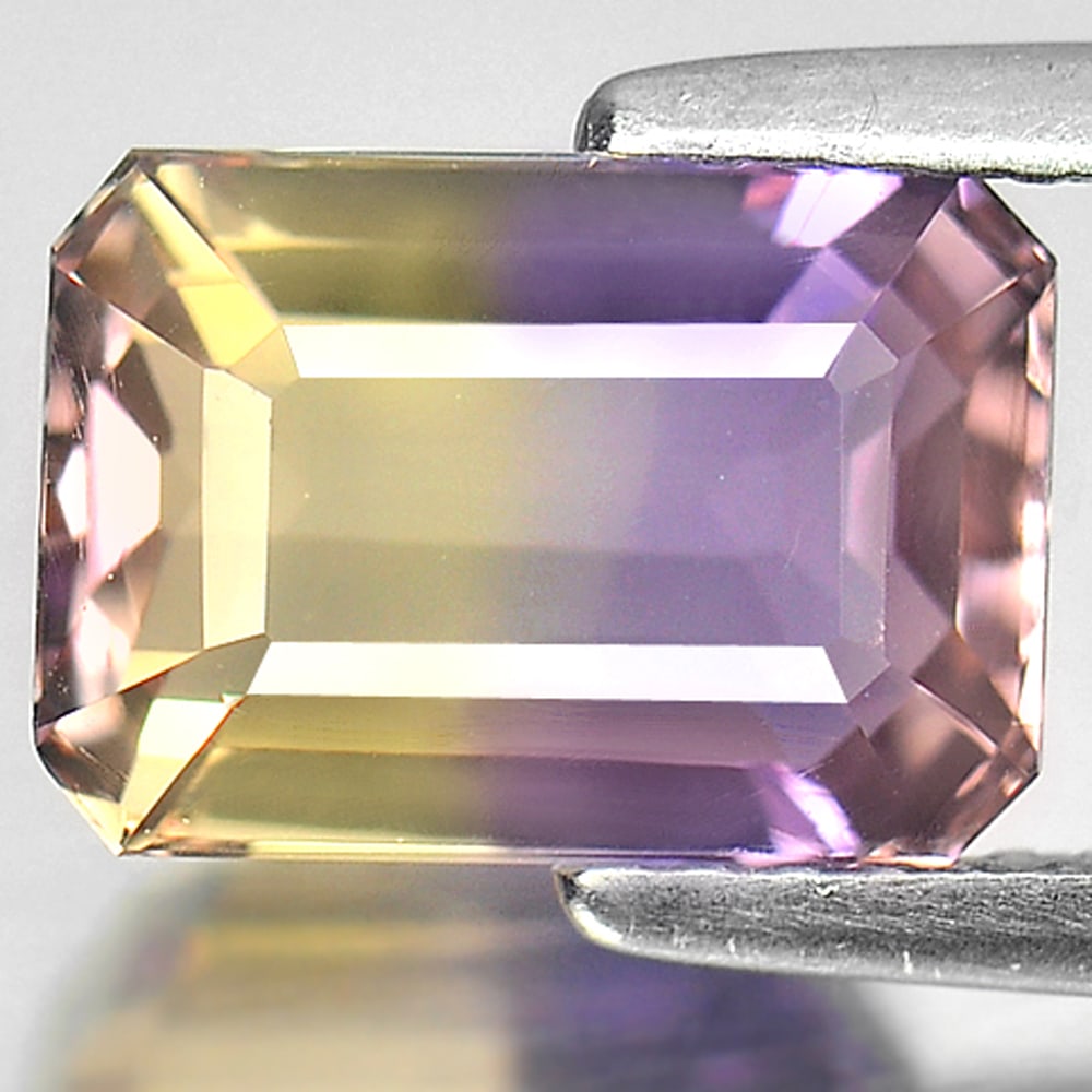 Natural Bi Color Ametrine 2.78 Ct. VVS Octagon Shape 9.6 x 6.7 Mm Gemstone From Bolivia: Product ID: 800405149 Product Name: Natural Ametrine Weight: 2.78 CT. Size: 9.6 x 6.7 x 5.4 MM. Shape: Octagon Color: Bi Color Clarity:VVS Luster: Good Gems Origin: Bolivia Treatment: Unheated Crystal