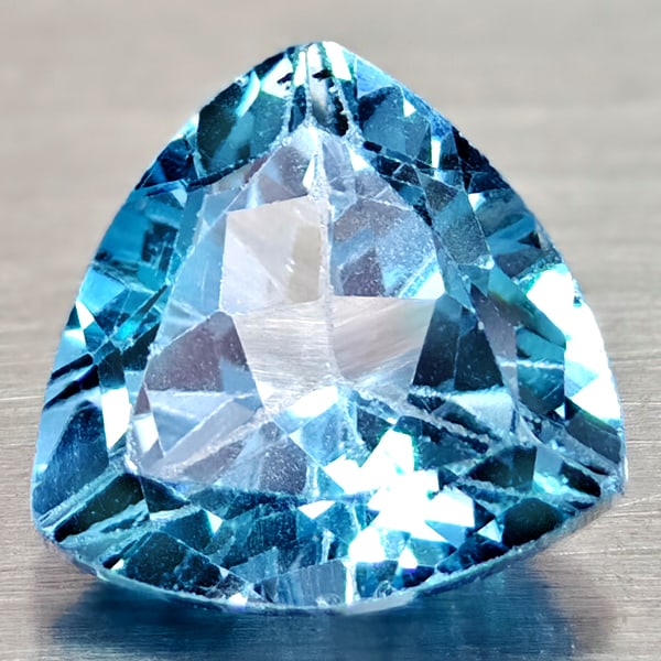 Natural Swiss Blue Topaz 3.13 Ct. Trilliant Shape 9.1 Mm Gemstones From Brazil: Product ID: 807167991 Product Name: Natural Blue Topaz Weight: 3.13 CT. Size: 9.1 x 9.1 x 5.8 MM. Shape: Trilliant Color: Swiss Blue Clarity:VSI Luster: Good Gems Origin: Brazil Treatment: Treated Cry