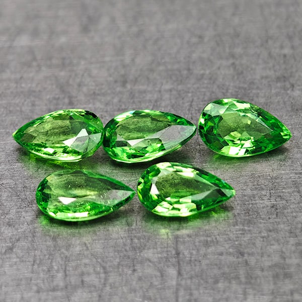 Natural Green Tsavorite Garnet 1.04 Ct. 5 Pcs Pear Shape 5 x 3.1 Mm Gemstones from Tanzania: Product ID: 803005012 Product Name: Natural Tsavorite Weight: 1.04 CT. Size: 5 x 3.1 x 1.8 MM. Shape: Pear Shape Color: Green Clarity:VSI Luster: Very Good Gems Origin: Tanzania Treatment: Unheated Cr