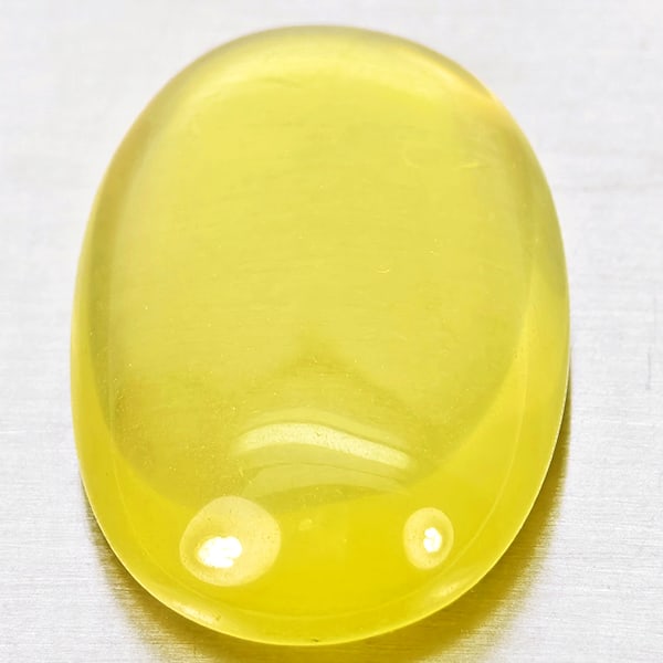 Natural Yellow Lemon Quartz 25.64 Ct.Oval Cabochon Shape 26 x 17.3 Mm Gemstone From Brazil: Product ID: 805530022 Product Name: Natural Quartz Weight: 25.64 CT. Size: 26 x 17.3 x 7.9 MM. Shape: Oval Cabochon Color: Yellow Lemon Clarity:Semi - Transparent Luster: Good Gems Origin: Brazil Trea