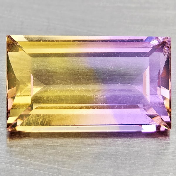 Natural Bi Color Ametrine 2.39 Ct. Baguette Shape 10.8 x 6.3 Mm Gemstone From Bolivia: Product ID: 800408525 Product Name: Natural Ametrine Weight: 2.39 CT. Size: 10.8 x 6.3 x 4.3 MM. Shape: Baguette Color: Bi Color Clarity:VSI Luster: Good Gems Origin: Bolivia Treatment: Unheated Cryst