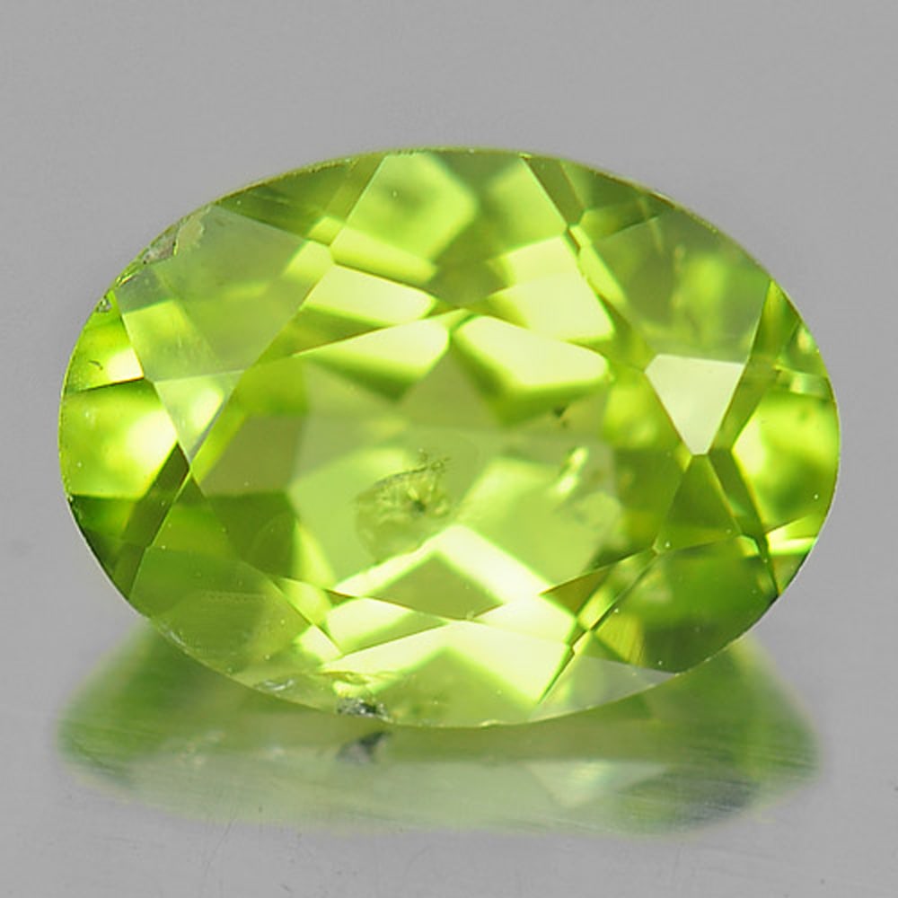 Natural Green Peridot 1.36 Ct. Oval Shape 8 x 6 Mm. Gemstone From Pakistan: Product ID: 805314294 Product Name: Natural Peridot Weight: 1.36 CT. Size: 8 x 6 x 4 MM. Shape: Oval Color: Green Clarity:SI1 Luster: Good Gems Origin: Pakistan Treatment: Unheated Crystal Structure: