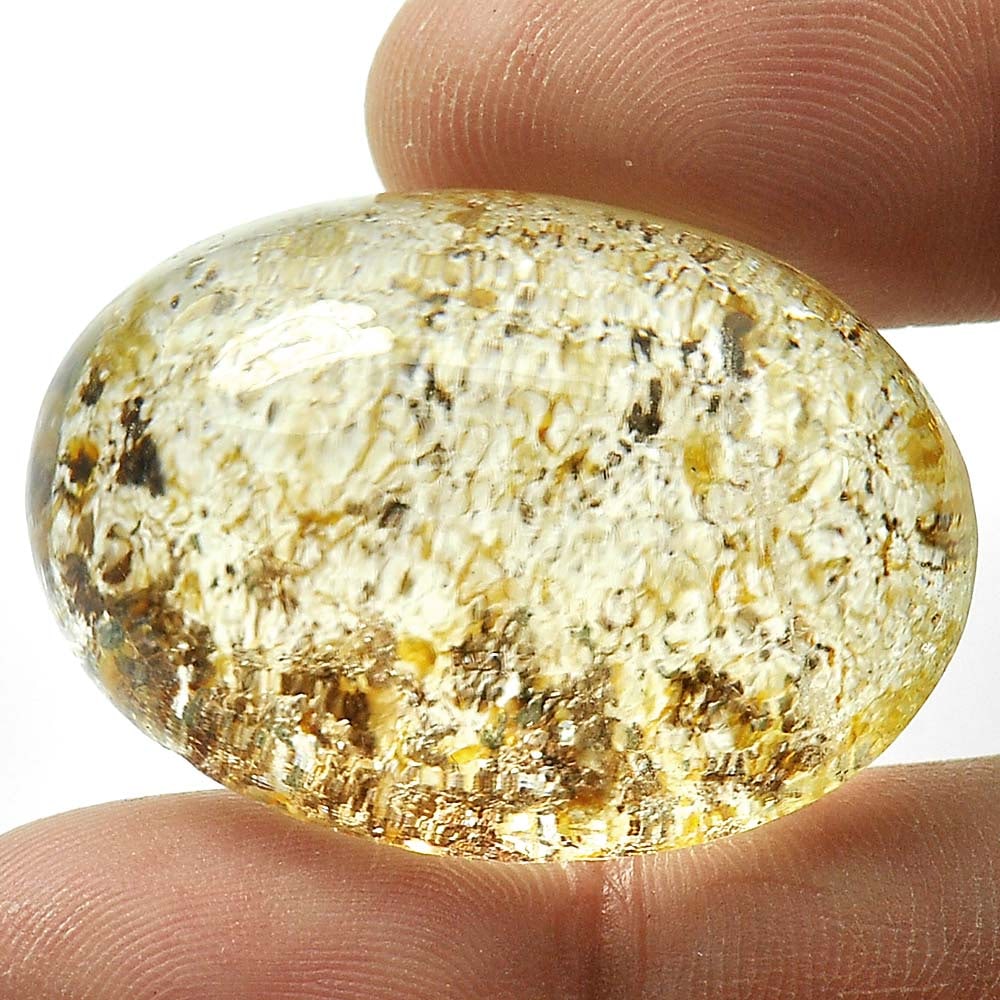 Natural Moss Quartz 75.58 Ct. Oval Cabochon Shape 32 x 23 Mm. Unheated Gemstone: Product ID: 805529213 Product Name: Natural Quartz Weight: 75.58 CT. Size: 32 x 23 x 15.6 MM. Shape: Oval Cabochon Color: White Clarity:Semi - Transparent Luster: Good Gems Origin: Thailand Treatment: