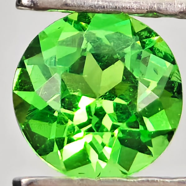 Natural Green Tsavorite Garnet 0.28 Ct. Round Shape 4.1 Mm Gemstone From Tanzania: Product ID: 803005079 Product Name: Natural Tsavorite Weight: 0.28 CT. Size: 4.1 x 4.1 x 2.5 MM. Shape: Round Shape Color: Green Clarity:SI Luster: Good Gems Origin: Tanzania Treatment: Unheated Cryst