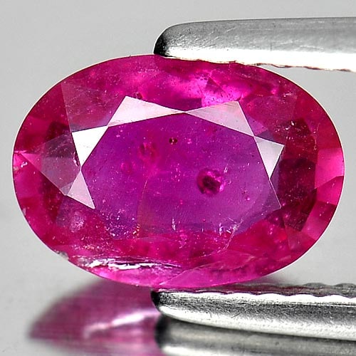 Natural Purplish Pink Ruby 1.57 Ct. Oval Shape 8.9 x 6.3 Mm Gemstone from Mozambique: Product ID: 805920462 Product Name: Natural Ruby Weight: 1.57 CT. Size: 8.9 x 6.3 x 3 MM. Shape: Oval Color: Purplish Pink Clarity:VSI Luster: Good Gems Origin: Mozambique Treatment: Heated (Lead-glas