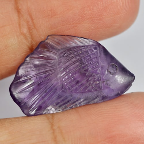 Natural Violet Amethyst Fish Carving 15.22 Ct. Size 25 x 15.4 Mm. Unheated Gemstone From Brazil: Product ID: 810303003 Product Name: Natural Amethyst Weight: 15.22 CT. Size: 25 x 15.4 x 7.3 MM. Shape: Fish Carving Color: Violet Clarity:Semi - Transparent Luster: Good Gems Origin: Brazil Treatment