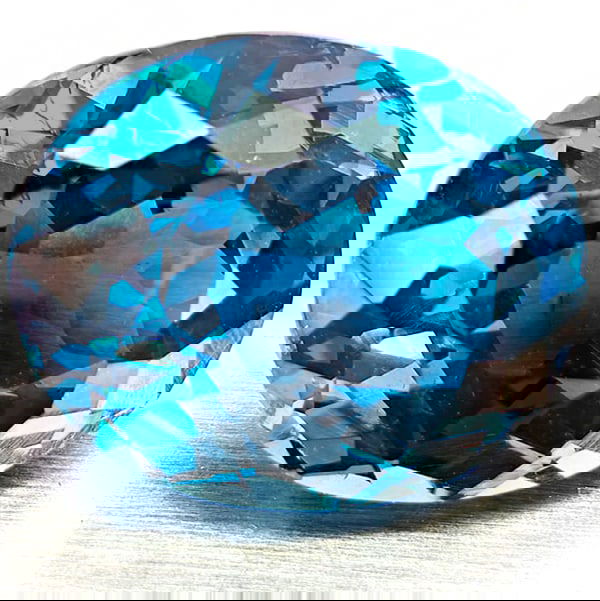Natural London Blue Topaz 5.97 Ct. Oval Shape 11.6 x 9.4 Mm Gemstone From Brazil: Product ID: 807168414 Product Name: Natural Blue Topaz Weight: 5.97 CT. Size: 9.4 x 11.6 x 6.9 MM. Shape: Oval Color: London Blue Clarity:VVS - VSI Luster: Very Good Gems Origin: Brazil Treatment: Tre