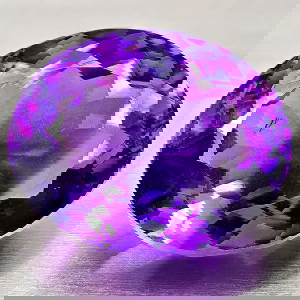 Natural Purple Amethyst 17.06 Ct. Oval Shape 17.2 x 14.1 Mm Gemstone from Brazil: Product ID: 800325478 Product Name: Natural Amethyst Weight: 17.06 CT. Size: 17.2 x 14.1 x 10.9 MM. Shape: Oval Color: Purple Clarity:VSI Luster: Good Gems Origin: Brazil Treatment: Unheated Crystal S