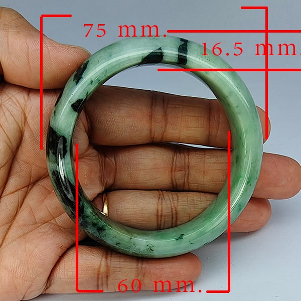Natural Green Jade Bangle 387.95 Ct. Diameter 60 Mm Gemstone from Thailand: Product ID: 819816146 Product Name: Natural Gemstones Weight: 387.95 CT. Size: 75 x 60 x 16.5 MM. Shape: Round Color: Multi-Color Clarity:Opaque Luster: Good Gems Origin: Thailand Treatment: Unheated 