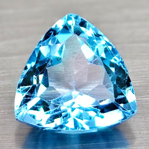 Natural Swiss Blue Topaz 2.57 Ct. Trilliant Shape 8.1 Mm Gemstone From Brazil: Product ID: 807167944 Product Name: Natural Blue Topaz Weight: 2.57 CT. Size: 8.1 x 8.1 x 5.3 MM. Shape: Trilliant Color: Swiss Blue Clarity:VSI Luster: Good Gems Origin: Brazil Treatment: Treated Cry