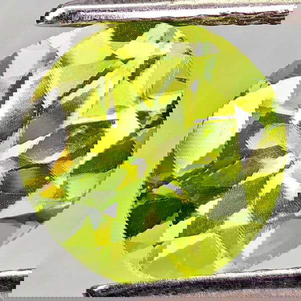 Natural Green Peridot 1.37 Ct. Round Shape 7.1 Mm. Gemstone From Pakistan: Product ID: 805317204 Product Name: Natural Peridot Weight: 1.37 CT. Size: 7.1 x 7.1 x 4.4 MM. Shape: Round Color: Green Clarity:VSI - SI1 Luster: Good Gems Origin: Pakistan Treatment: Unheated Crysta