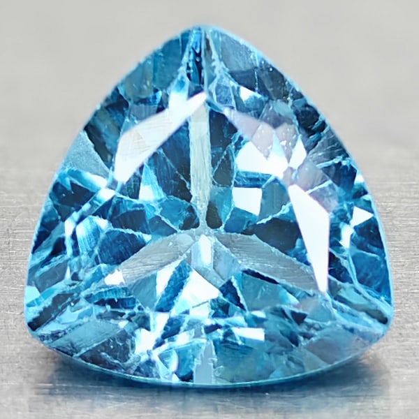 Natural Swiss Blue Topaz 3.21 Ct. Trilliant Shape 9 Mm Gemstone From Brazil: Product ID: 807167870 Product Name: Natural Blue Topaz Weight: 3.21 CT. Size: 9 x 9 x 6 MM. Shape: Trilliant Color: Swiss Blue Clarity:VSI Luster: Good Gems Origin: Brazil Treatment: Treated Crystal S