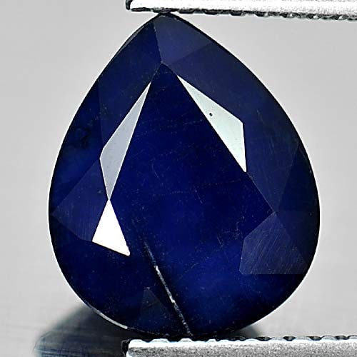 Natural Deep Blue Diffusion Sapphire 3.57 Ct. Pear Shape 10.9 x 9 Mm Gemstone From Madagascar: Product ID: 806011464 Product Name: Natural Blue Sapphire Weight: 3.57 CT. Size: 10.9 x 9 x 5 MM. Shape: Pear Color: Deep Blue Clarity:Opaque Luster: Good Gems Origin: Madagascar Treatment: Diffusion 