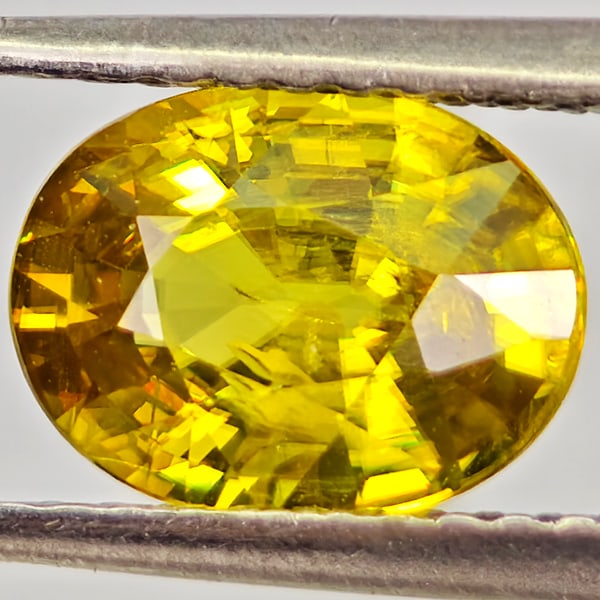 Natural Multi Color Titanium Sphene With Rainbow Spark 1.58 Ct. Oval Shape 8.3 x 6.3 Mm Gemstone: Product ID: 806590950 Product Name: Natural Sphene Weight: 1.58 CT. Size: 8.3 x 6.3 x 4 MM. Shape: Oval Color: Multi Color Titanium With Rainbow Spark Clarity:VSI - SI1 Luster: Very Good Gems Origin: 