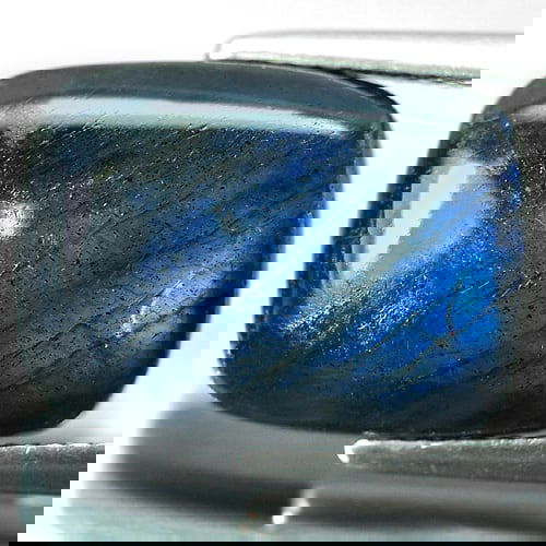 Natural Multi Color Blue Natural Labradorite Doublet 8.57 Ct. Baguette Cabochon Shape 16 x 12 Mm.: Product ID: 804301212 Product Name: Natural Labradorite Weight: 8.57 CT. Size: 16 x 12 x 4.8 MM. Shape: Baguette Cabochon Color: Multi-Color Clarity:Opaque Luster: Iridescent Gems Origin: Canada Treat