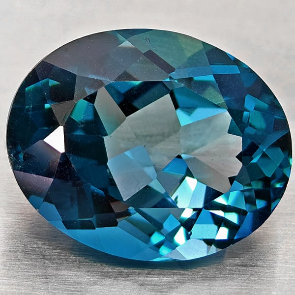 Natural London Blue Topaz 5.47 Ct. Oval Shape 12 x 9.6 Mm Gemstone From Brazil: Product ID: 807168400 Product Name: Natural Blue Topaz Weight: 5.47 CT. Size: 12 x 9.6 x 6.4 MM. Shape: Oval Shape Color: London Blue Clarity:VVS - VSI Luster: Good Gems Origin: Brazil Treatment: Trea