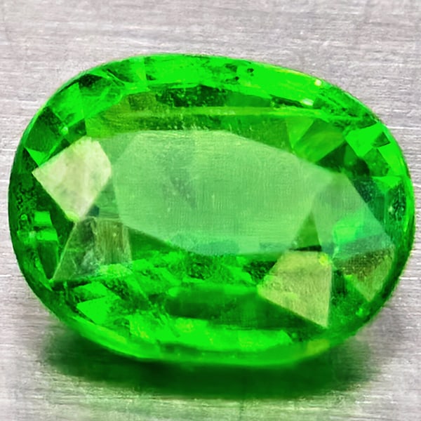 Natural Green Tsavorite Garnet 0.60 Ct. Oval Shape 5.9 x 4.3 Mm Gemstone From Tanzania: Product ID: 802937036 Product Name: Natural Tsavorite Weight: 0.60 CT. Size: 5.6 x 4.5 x 2.8 MM. Shape: Oval Shape Color: Green Clarity:SI1 Luster: Good Gems Origin: Tanzania Treatment: Unheated Cryst