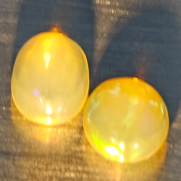 Natural Multi Color Play Of Colour Opal 1.66 Ct. 2 Pcs Oval Cabochon Shape Gemstones From Ethiopia: Product ID: 818728343 Product Name: Natural Opal Weight: 1.66 CT. Size: 8.1 x 5.7 x 4.4 MM. Shape: Oval Cabochon Color: Multi-Color Clarity:None Luster: Good Gems Origin: Ethiopia Treatment: Unheated