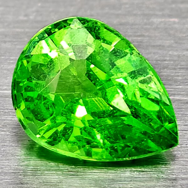 Natural Green Tsavorite Garnet 0.39 Ct. Pear Shape 4.7 x 3.6 Mm Gemstone From Tanzania: Product ID: 802937042 Product Name: Natural Tsavorite Weight: 0.39 CT. Size: 4.7 x 3.6 x 2.7 MM. Shape: Pear Shape Color: Green Clarity:SI1 Luster: Good Gems Origin: Tanzania Treatment: Unheated Cryst