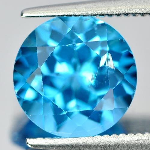 Natural Swiss Blue Topaz 3.47 Ct. Round Shape 9 Mm Gemstone from Brazil: Product ID: 807155899 Product Name: Natural Blue Topaz Weight: 3.47 CT. Size: 9 x 9 x 6.2 MM. Shape: Round Color: Swiss Blue Clarity:VSI Luster: Good Gems Origin: Brazil Treatment: Treated Crystal Str