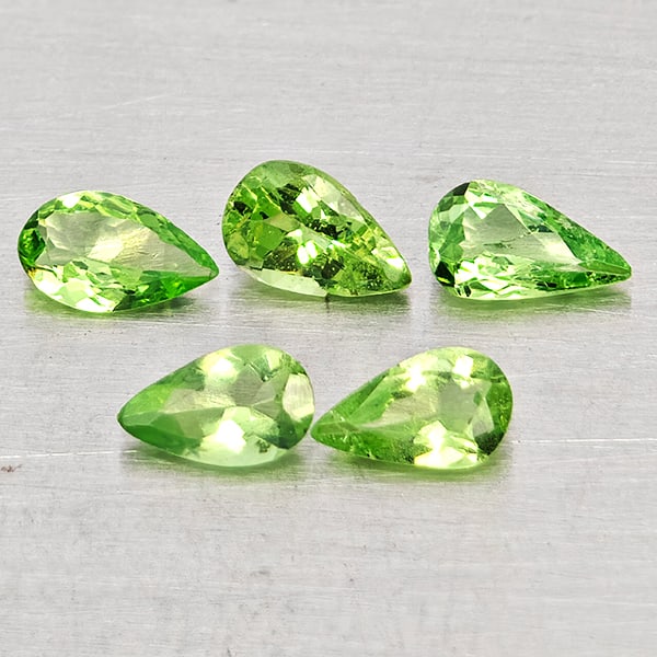 Natural Green Tsavorite Garnet 0.80 Ct. 5 Pcs Pear Shape Gemstones From Tanzania: Product ID: 803005109 Product Name: Natural Tsavorite Weight: 0.80 CT. Size: 4 x 2.8 x 1.8 MM. Shape: Pear Shape Color: Green Clarity:SI Luster: Good Gems Origin: Tanzania Treatment: Unheated Crystal