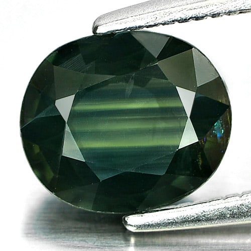Natural Green Sapphire 1.53 Ct. Oval Shape 8 x 6.8 Mm. Gemstone From Thailand: Product ID: 806152661 Product Name: Natural Green Sapphire Weight: 1.53 CT. Size: 8 x 6.8 x 3.2 MM. Shape: Oval Color: Green Clarity:VVS Luster: Good Gems Origin: Thailand Treatment: Heated Crystal St