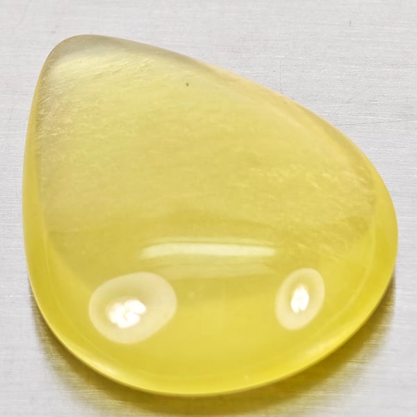 Natural Yellow Lemon Quartz 20.87 Ct. Pear Cabochon Shape 24 x 18.7 Mm Gemstone From Brazil: Product ID: 805530038 Product Name: Natural Quartz Weight: 20.87 CT. Size: 24 x 18.7 x 7.9 MM. Shape: Pear Cabochon Color: Yellow Lemon Clarity:Semi - Transparent Luster: Good Gems Origin: Brazil Trea