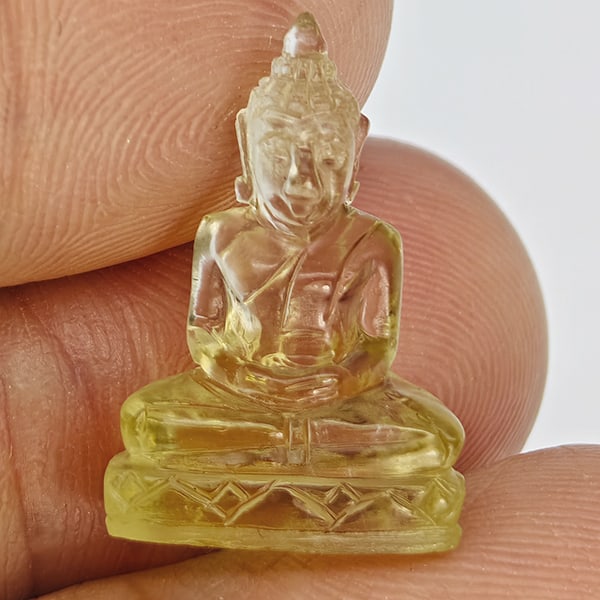Natural Yellow Quartz Buddha Carving 7.46 Ct. Size 19.2 x 13.3 Mm Gemstone from Brazil: Product ID: 805530224 Product Name: Natural Quartz Weight: 7.46 CT. Size: 19.2 x 13.3 x 7 MM. Shape: Carving Color: Yellow Clarity:VSI Luster: Good Gems Origin: Burma Treatment: Unheated Crystal Struc
