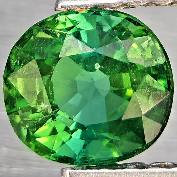 Natural Blueish Green Tourmaline 0.84 Ct. Oval Shape 5.8 x 5.7 Mm Gemstone from Nigeria: Product ID: 807251137 Product Name: Natural Tourmaline Weight: 0.84 CT. Size: 5.8 x 5.7 x 4.2 MM. Shape: Oval Shape Color: Blueish Green Clarity:SI1 Luster: Good Gems Origin: Nigeria Treatment: Unheat