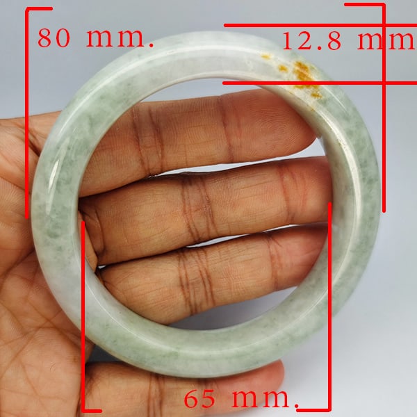 Natural Genuine Mulit Color Jade 380.10 Ct. Bangle Round Shape 80 x 65 Mm Gemstone From Thailand: Product ID: 819816100 Product Name: Natural Gemstones Weight: 380.10 CT. Size: 80 x 65 x 12.8 MM. Shape: Round Shape Color: Multi-Color Green Clarity:Opaque Luster: Good Gems Origin: Thailand Treatmen