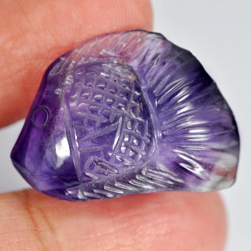 Natural Violet Amethyst 25.64 Ct. Fish Carving Size 26 x 19 Mm. Unheated Gemstone From Brazil: Product ID: 810302297 Product Name: Natural Amethyst Weight: 25.64 CT. Size: 26 x 19 x 9.4 MM. Shape: Fish Carving Color: Violet Clarity:Semi - Transparent Luster: Good Gems Origin: Brazil Treatment: